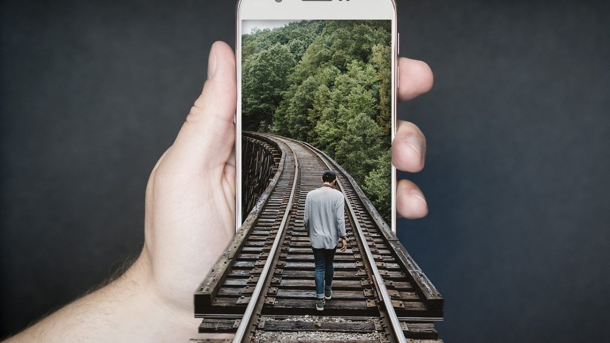 Train track, railroad, smartphone — Is AI Sex Chat the Future of Virtual Relationships?