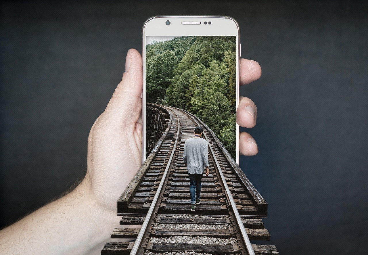 Train track, railroad, smartphone — Is AI Sex Chat the Future of Virtual Relationships?