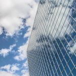 Building, reflection, clouds — Website Design and Development Agency: Full-Service Solutions