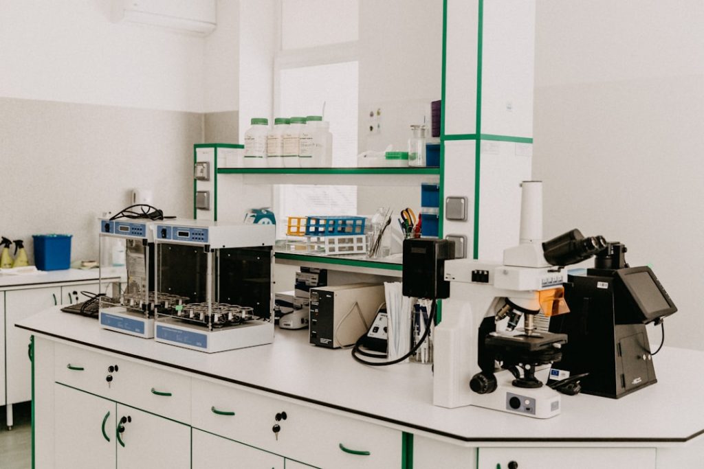 Laboratory workspace with scientific equipment and materials for cancer research.