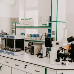 Laboratory workspace with scientific equipment and materials for cancer research.