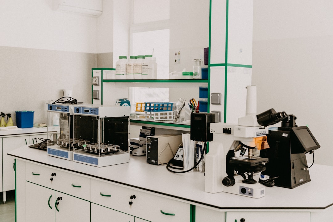 Laboratory workspace with scientific equipment and materials for cancer research.