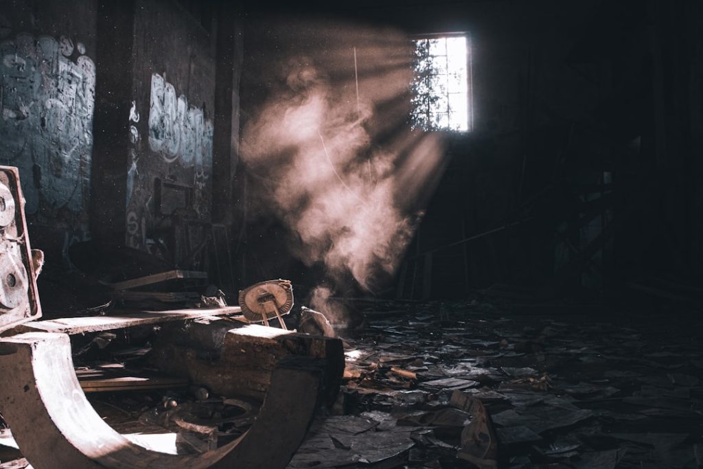 sunlight filtering through a dusty, abandoned building