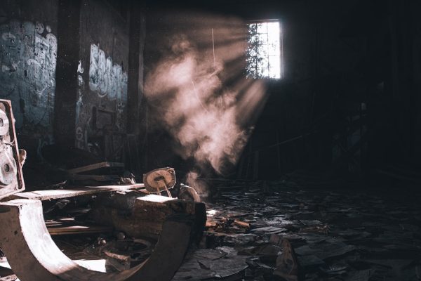 sunlight filtering through a dusty, abandoned building